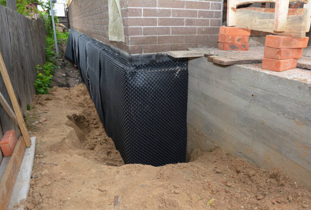 Happy homeowners after waterproofing job in Blakeslee